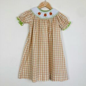 Castles and Crowns Halloween or Thanksgiving smocked plaid pumpkin dress.  4T